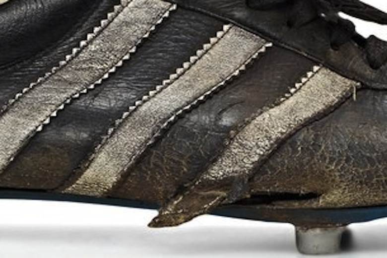 Golf and tension in Russia hurt adidas