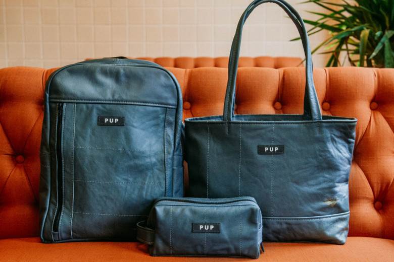 Luxury bags made from repurposed leather train seats
