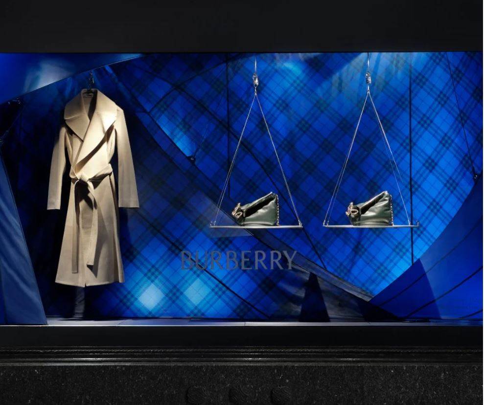 Burberry shows new colours but warns of slowing demand