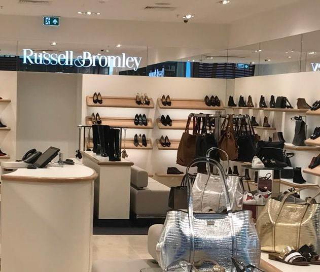 Next acquires Russell & Bromley